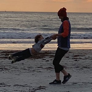 Memory and Aging Program Nurse Practitioner Brittany Dawson on the beach with her son at the Newport Cliff Walk